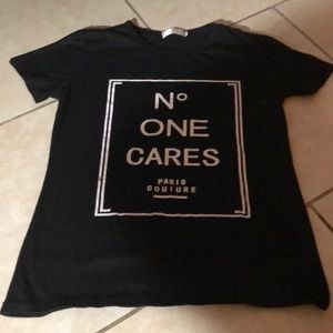 It’s a black shirt that says “No one cares”